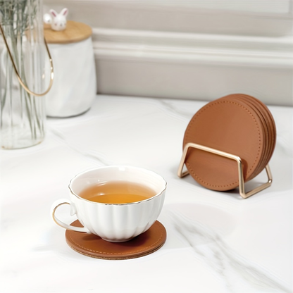 6 faux leather coasters with metal stands and cork bases