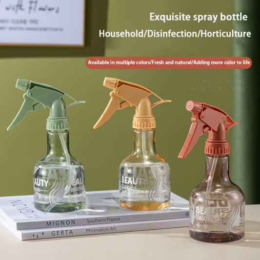 A handheld spray bottle with an ergonomic grip and precision nozzle.